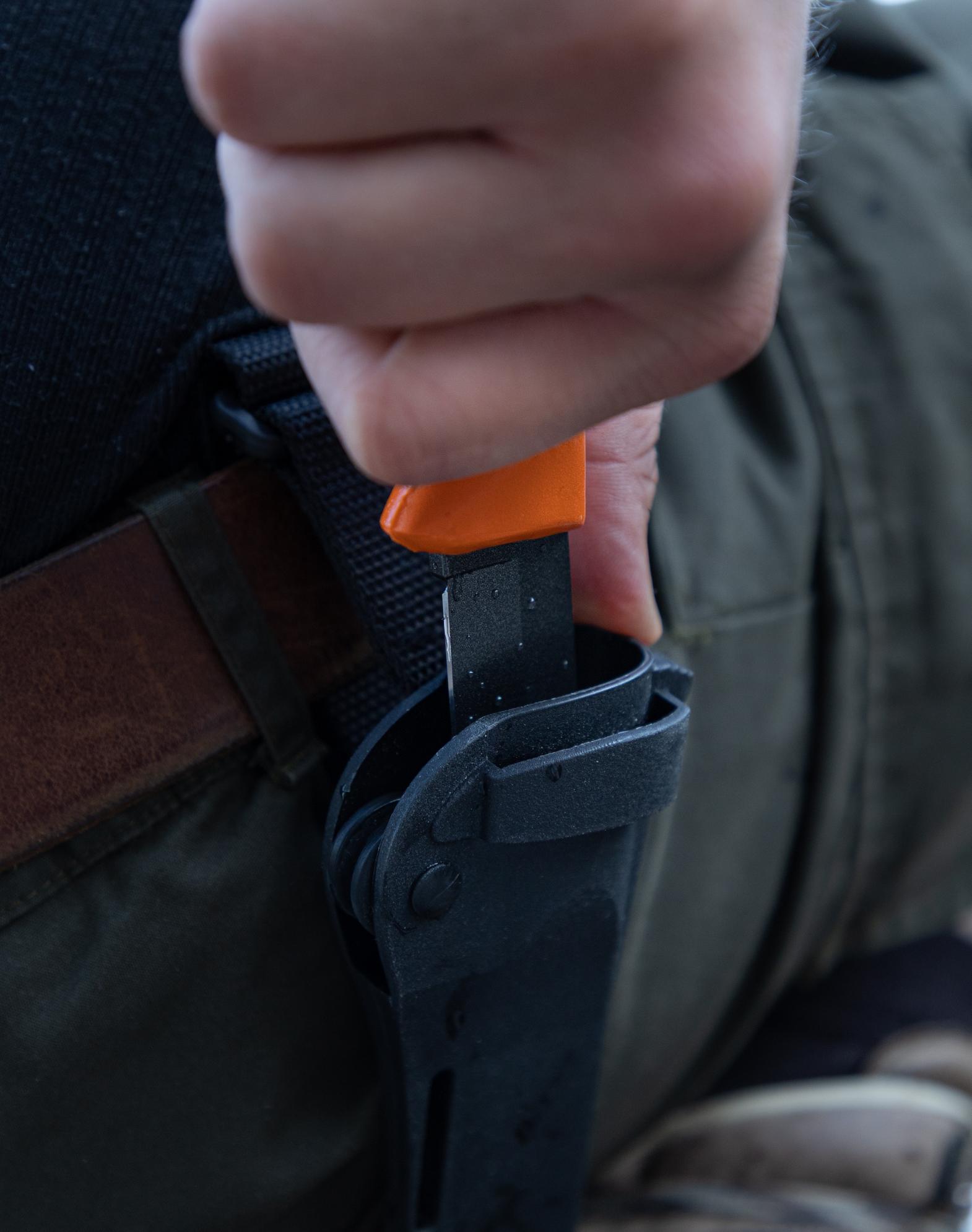 Innovative sheath - composite plastic, roll mechanism. Easy to carry in MOLLE systems. Color options available.